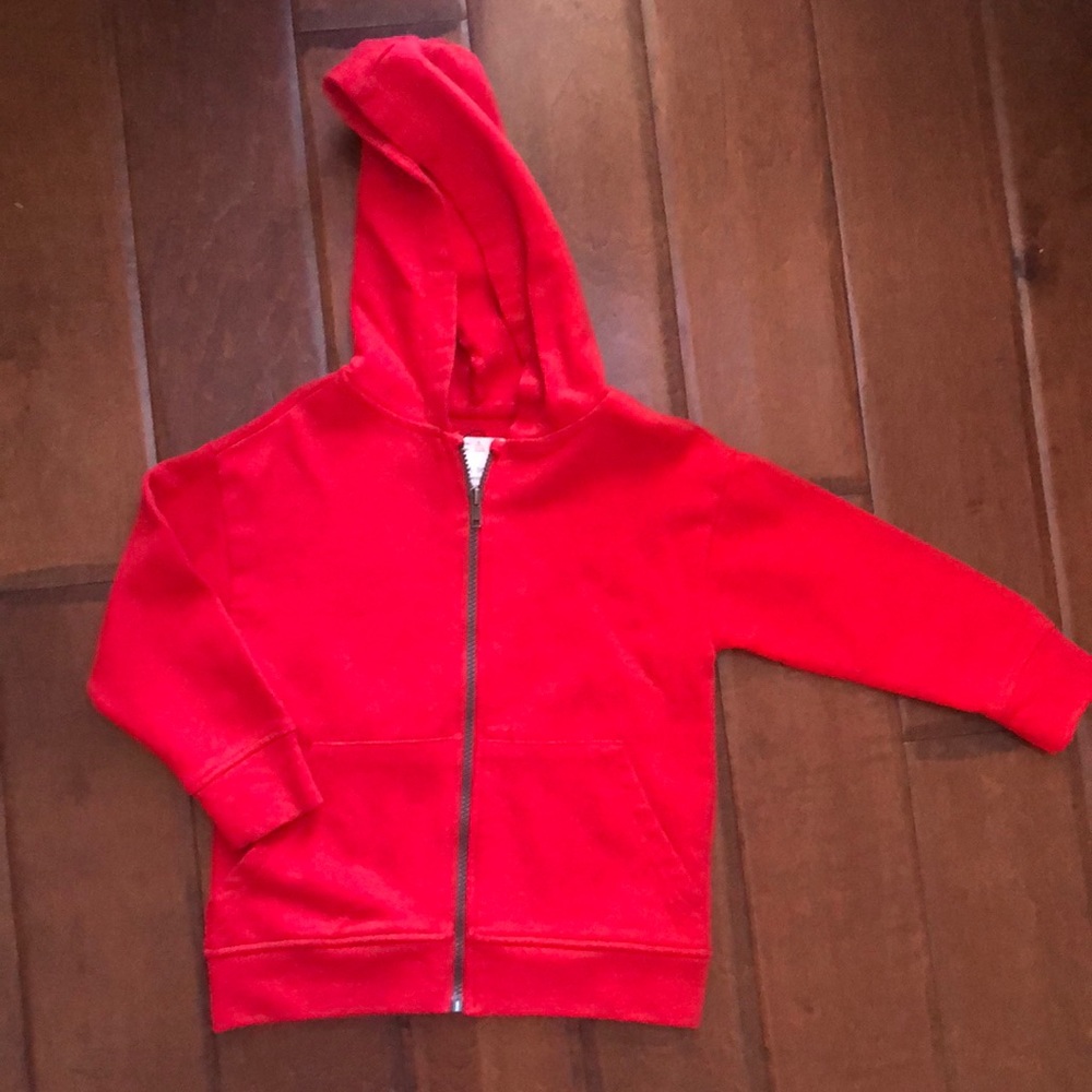 ZARA red zip hoodie with graphic text.